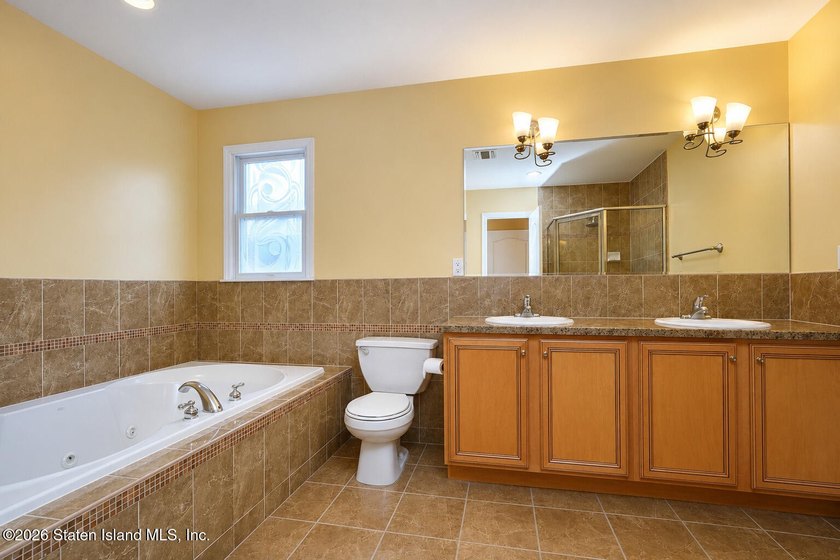 This gorgeous 2-family, 4-bedroom, 3-bathroom, side-hall - photo 24