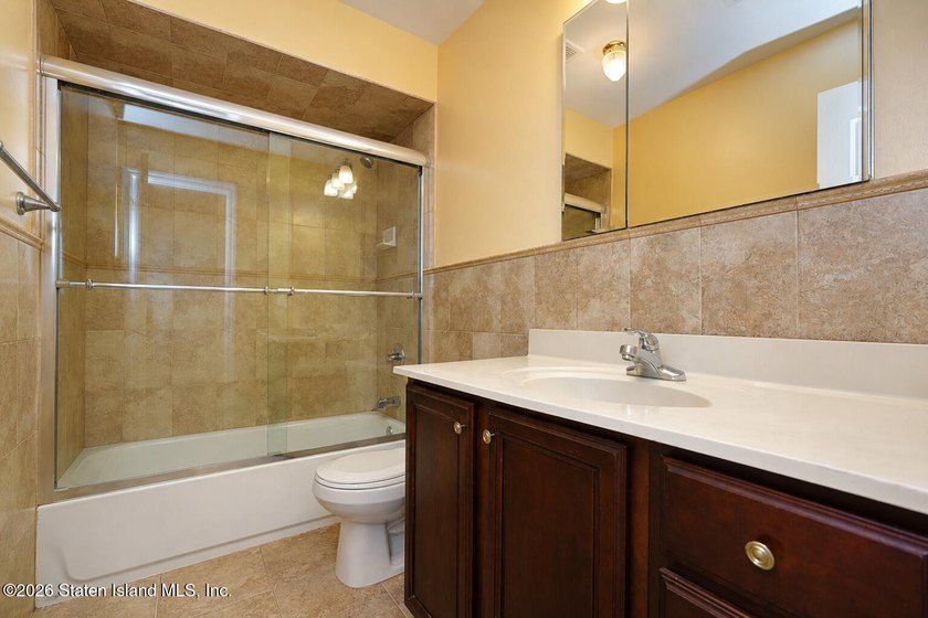 This gorgeous 2-family, 4-bedroom, 3-bathroom, side-hall - photo 32