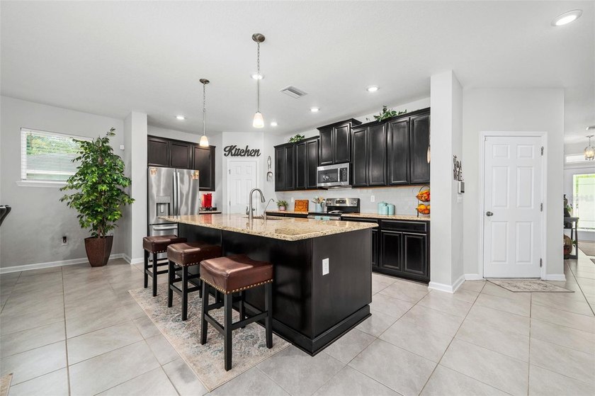 This stunning 2020 David Weekley home perfectly blends modern - photo 10