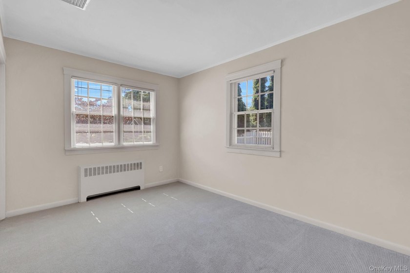 Welcome to this beautifully expanded ranch nestled in one of the - photo 13