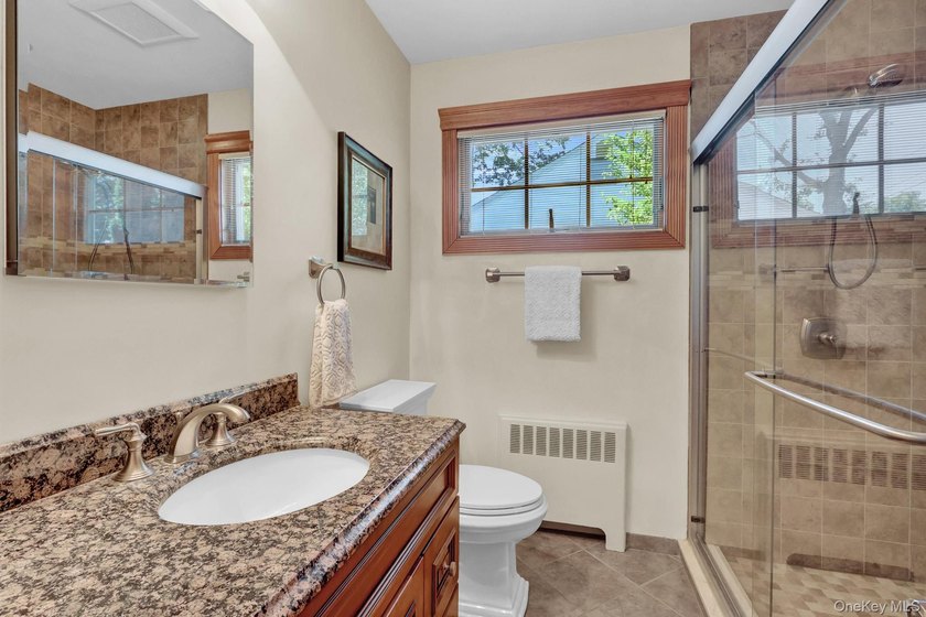 Welcome to this beautifully expanded ranch nestled in one of the - photo 17
