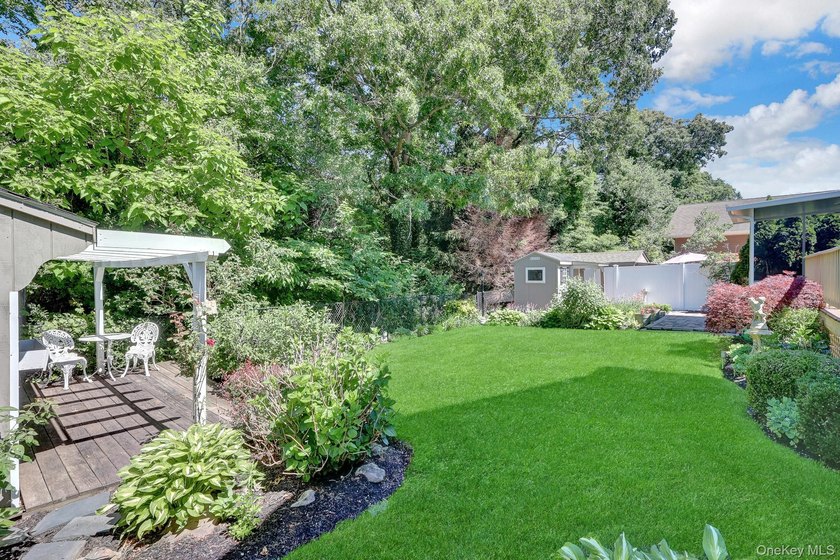 Welcome to this beautifully expanded ranch nestled in one of the - photo 36
