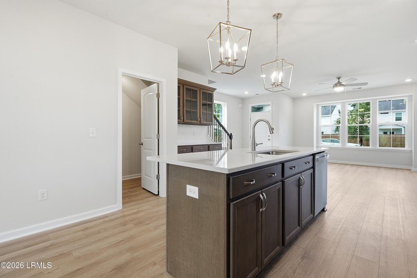 This two-story home includes three bedrooms and two and one-half - photo 11