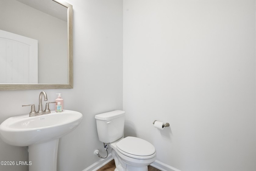 This two-story home includes three bedrooms and two and one-half - photo 15