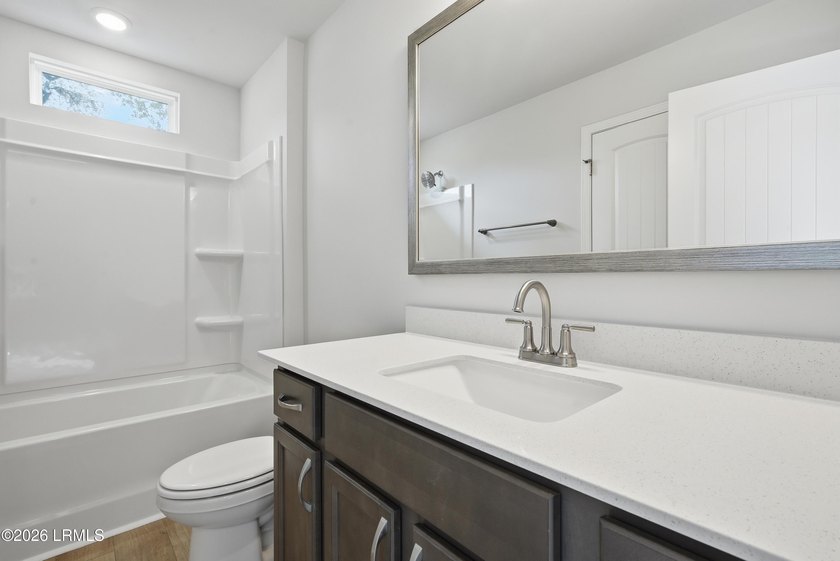 This two-story home includes three bedrooms and two and one-half - photo 21