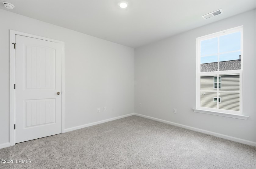This two-story home includes three bedrooms and two and one-half - photo 22