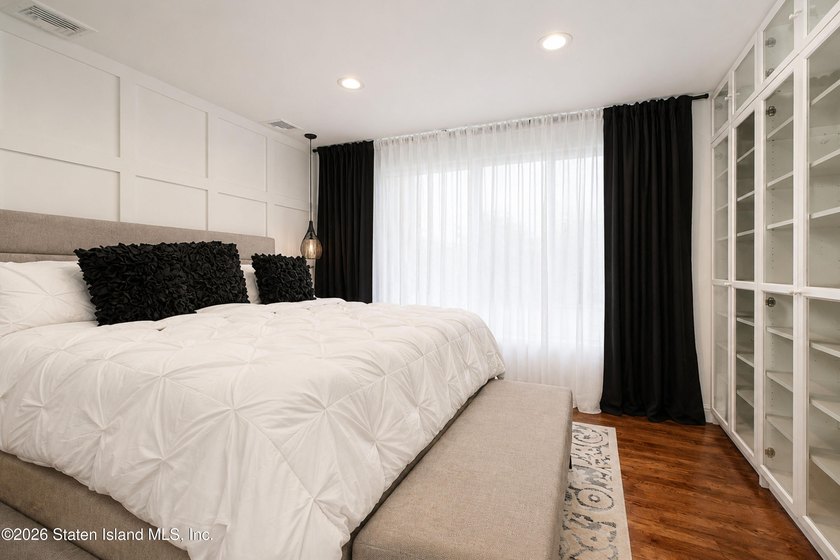 Welcome to this exceptional detached two-family residence where - photo 16