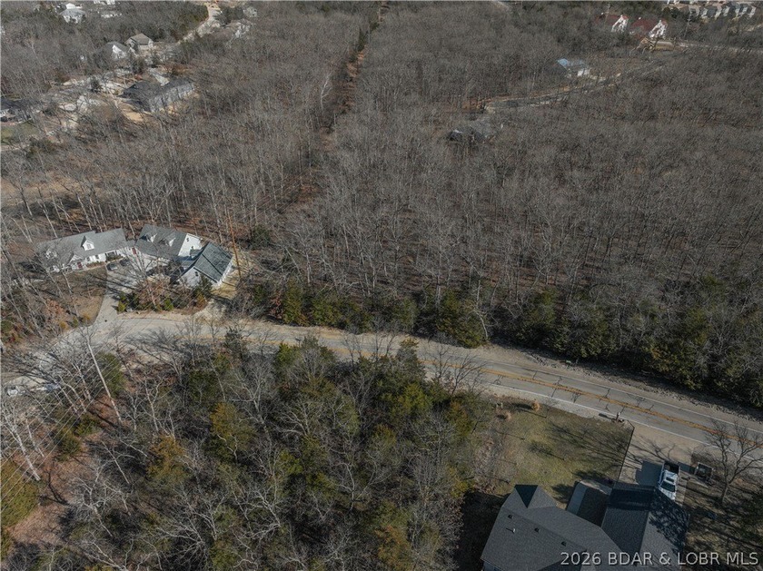 Flat 0.4-acre lot located in Four Seasons POA, offering an - photo 11