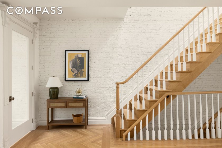 This meticulously renovated single-family home offers five - photo 2