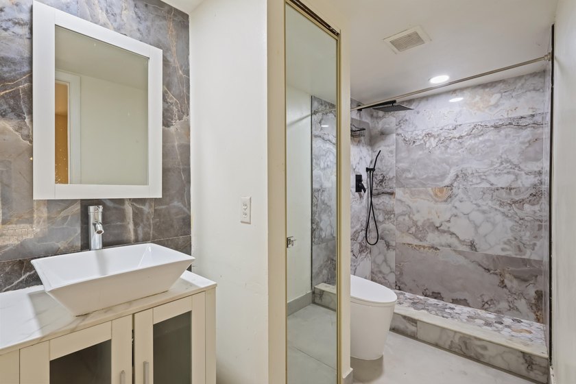 Welcome to this updated 2BR/2.5BA townhouse in the Village of - photo 12