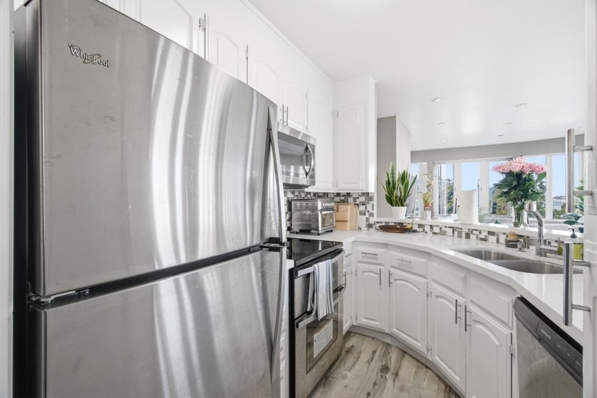 Welcome to this stunning 2-bedroom, 2-bath corner residence in a - photo 21