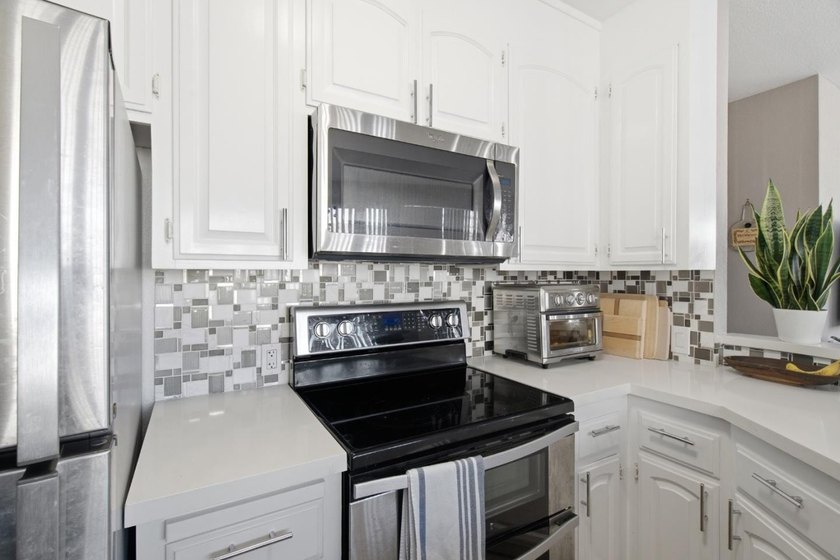 Welcome to this stunning 2-bedroom, 2-bath corner residence in a - photo 22