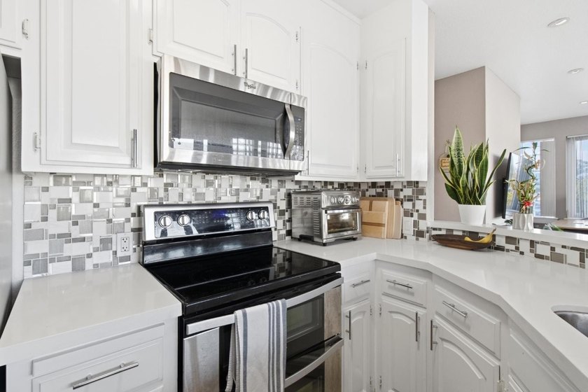 Welcome to this stunning 2-bedroom, 2-bath corner residence in a - photo 23