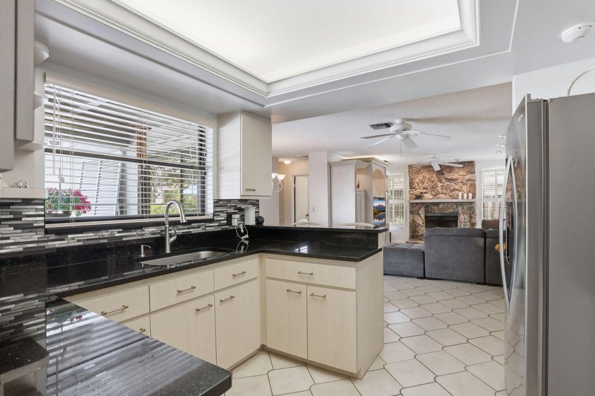 Welcome to this beautifully updated one-story pool home in - photo 8