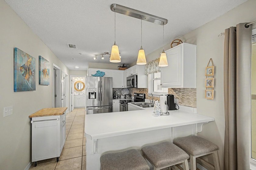 Fully furnished and turnkey, this beautifully maintained coastal - photo 13