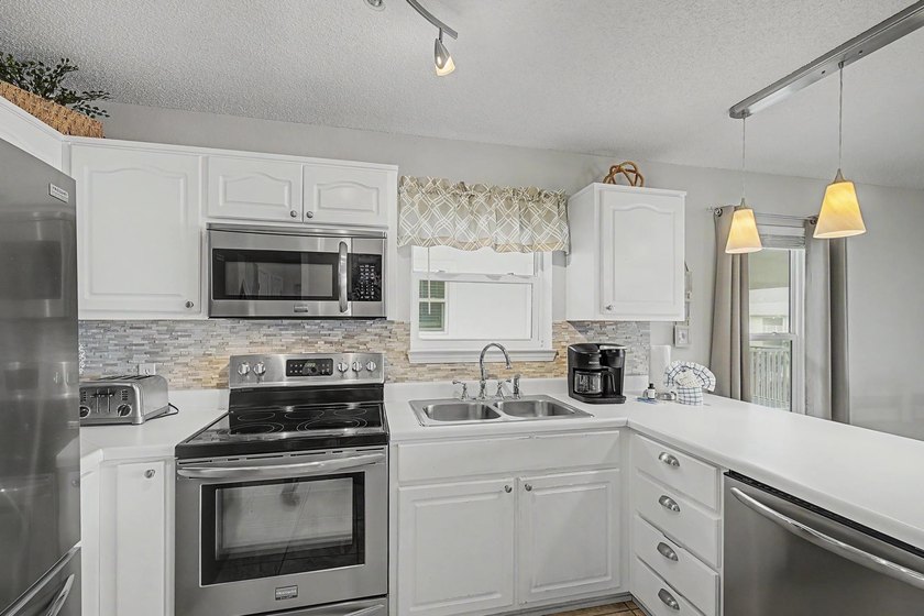 Fully furnished and turnkey, this beautifully maintained coastal - photo 17