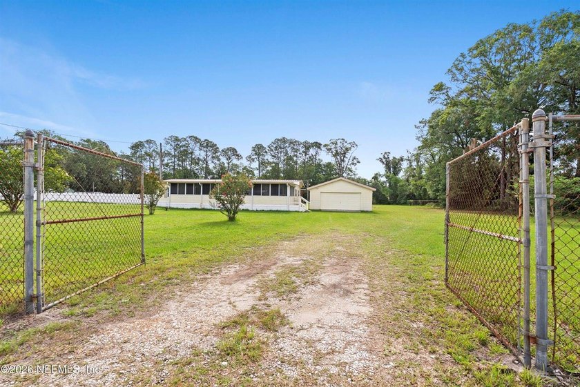 Rare opportunity to own 1.86 fully fenced acres in Jacksonville! - photo 11
