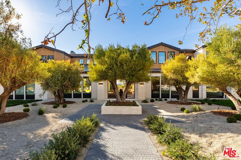 Completed in 2025, this stunning custom estate is sited in the - photo 2