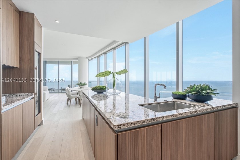 Occupying half of the 34th floor at UNA Residences, this - photo 7