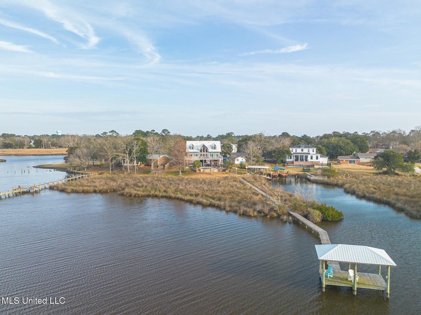 Introducing a rare riverfront retreat in the sought-after - photo 2