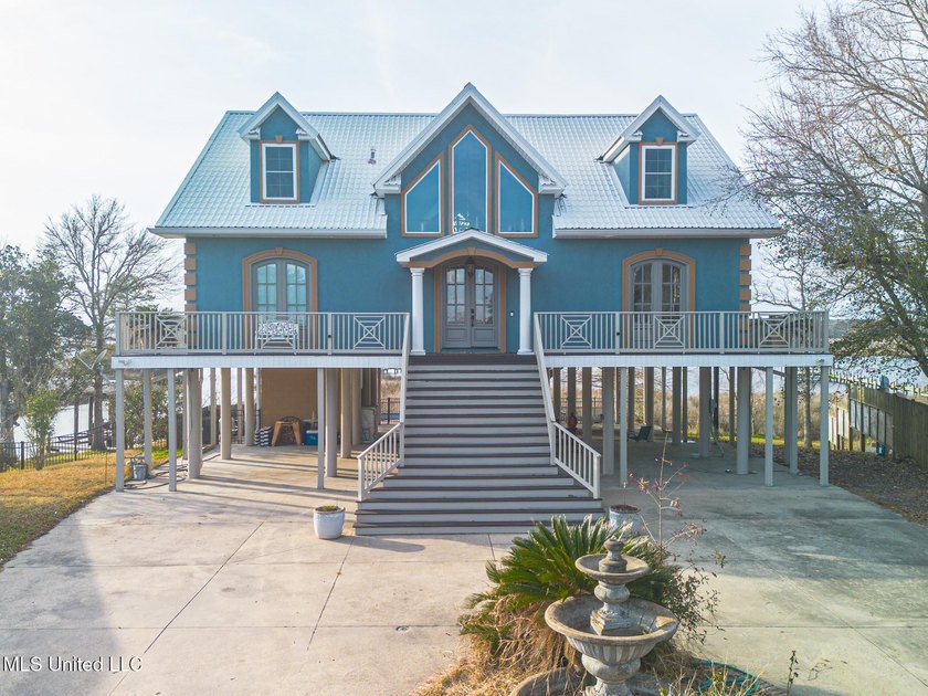 Introducing a rare riverfront retreat in the sought-after - photo 3