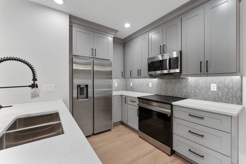 Life at 455 Riverview Avenue begins beneath the quiet canopy of - photo 14