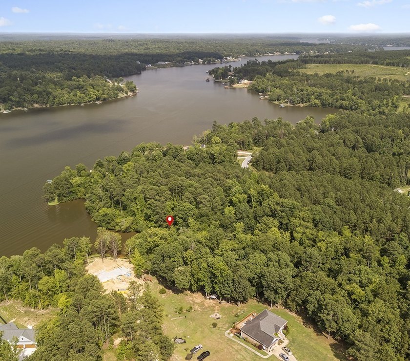 Welcome to Eagles Harbor, a private gated lake community where - photo 2