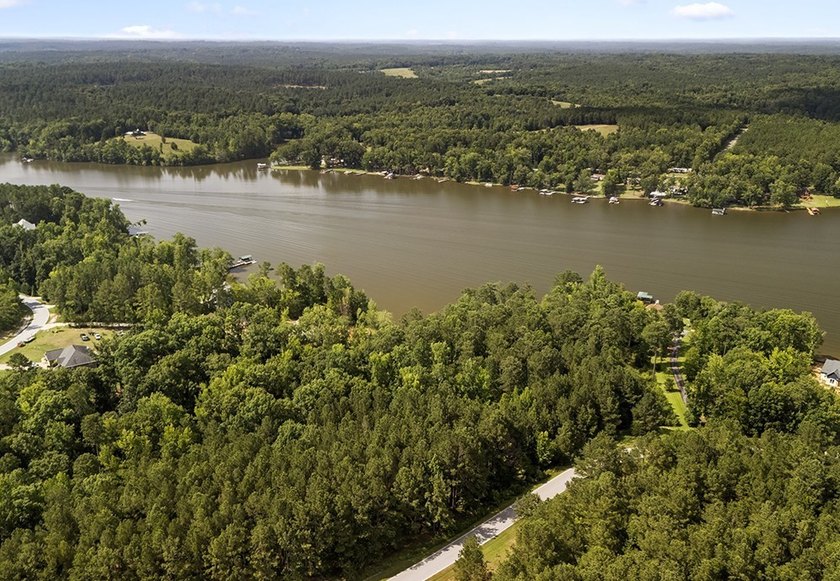 Welcome to Eagles Harbor, a private gated lake community where - photo 3