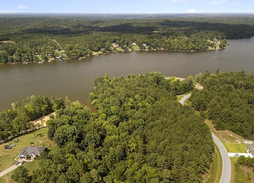 Welcome to Eagles Harbor, a private gated lake community where - photo 4