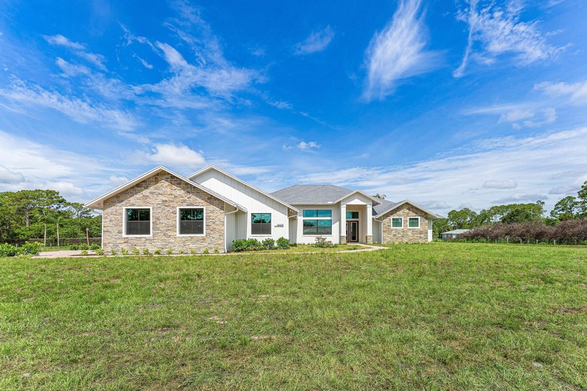 Welcome to 16631 132nd Terrace North, a newly completed custom - photo 2