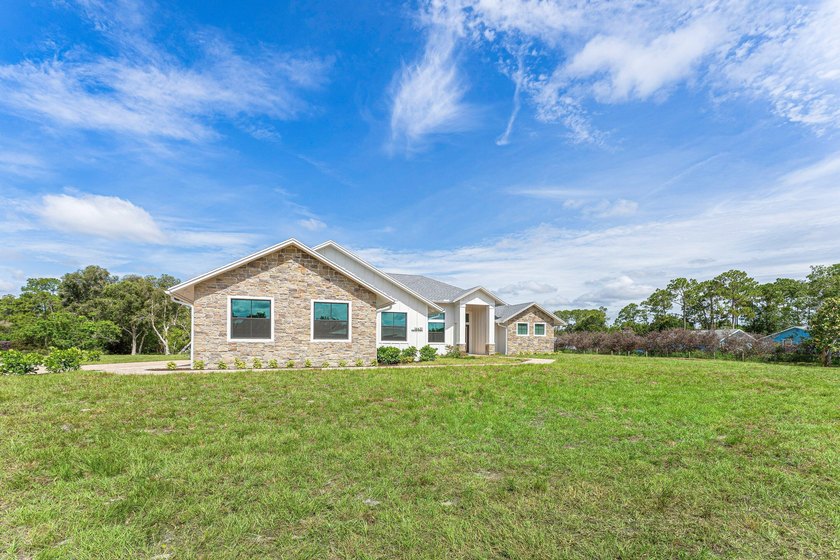 Welcome to 16631 132nd Terrace North, a newly completed custom - photo 4