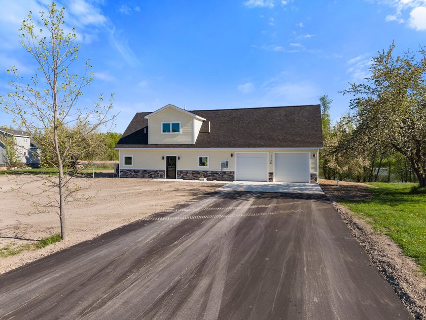 Brand new construction on the beautiful Cheboygan River! Enjoy - photo 7