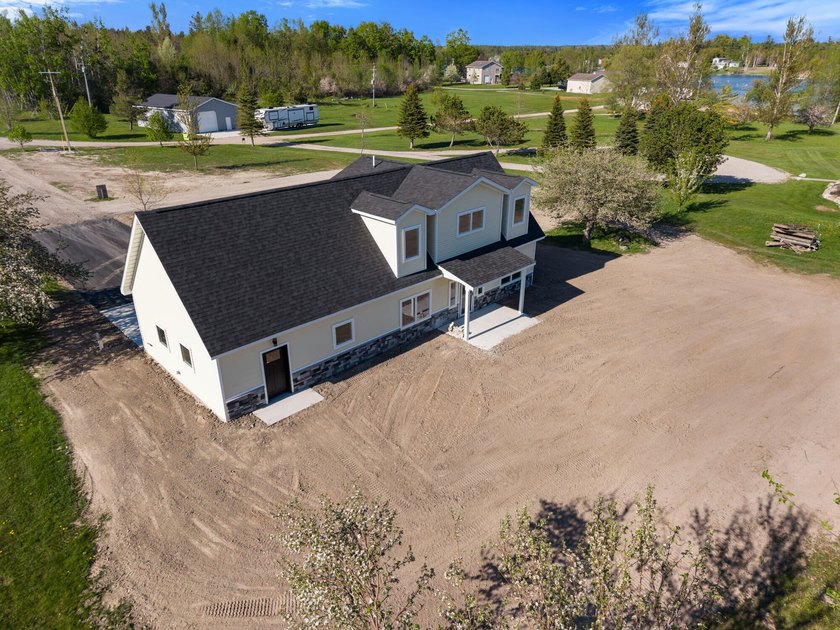 Brand new construction on the beautiful Cheboygan River! Enjoy - photo 10