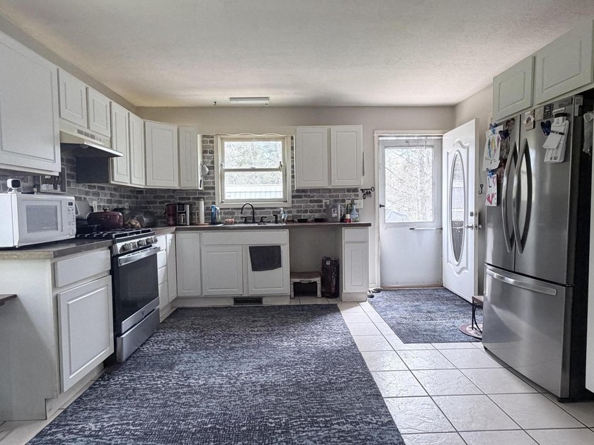 Charming 4-bedroom, 1-bath handicap accessible home nestled on a - photo 6