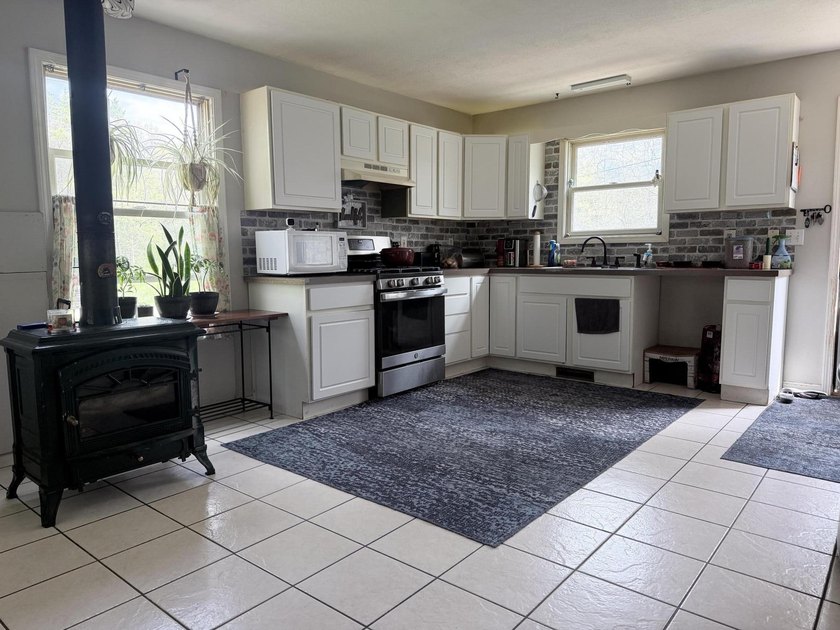 Charming 4-bedroom, 1-bath handicap accessible home nestled on a - photo 7