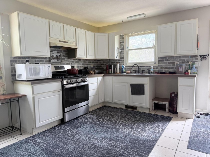 Charming 4-bedroom, 1-bath handicap accessible home nestled on a - photo 8