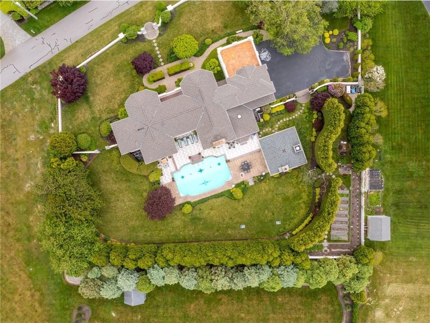 Set behind layers of mature landscaping and sculpted hedges - photo 48