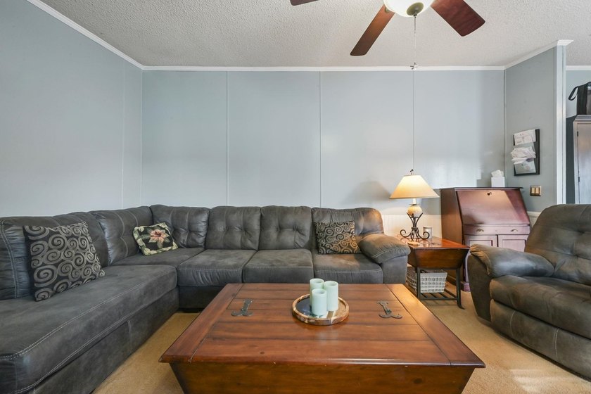 Welcome to 6043 East West Way, an inviting coastal home nestled - photo 13