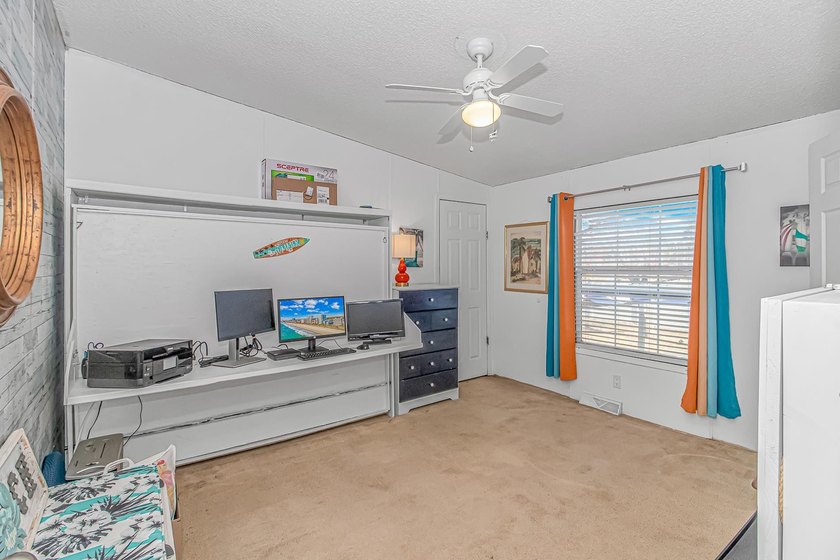 Welcome to 6043 East West Way, an inviting coastal home nestled - photo 14