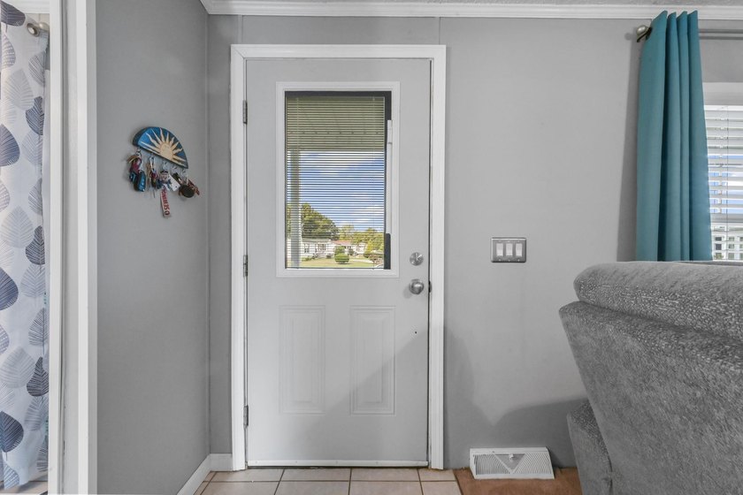 Welcome to 6043 East West Way, an inviting coastal home nestled - photo 20