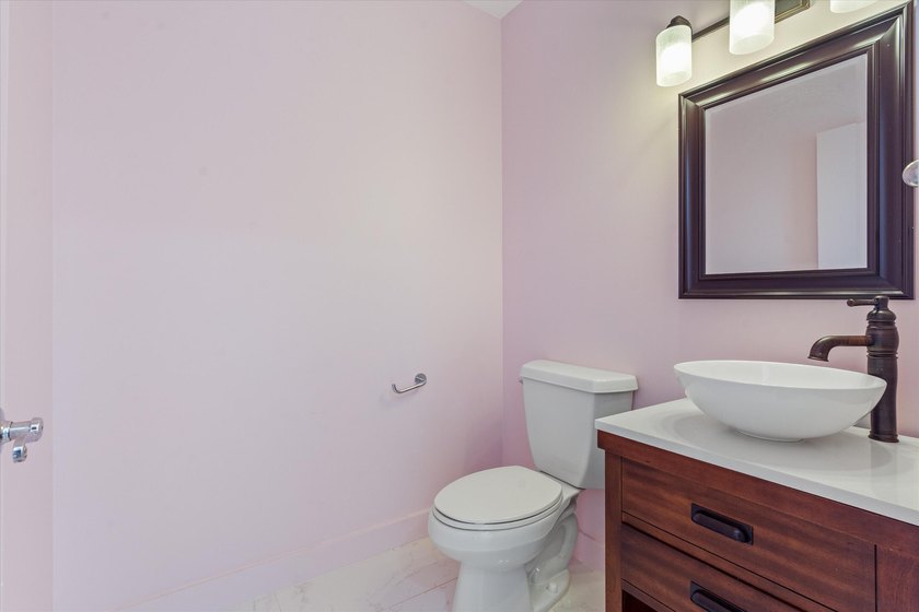This beautifully renovated 2-bedroom, 2.5-bath townhome offers a - photo 15