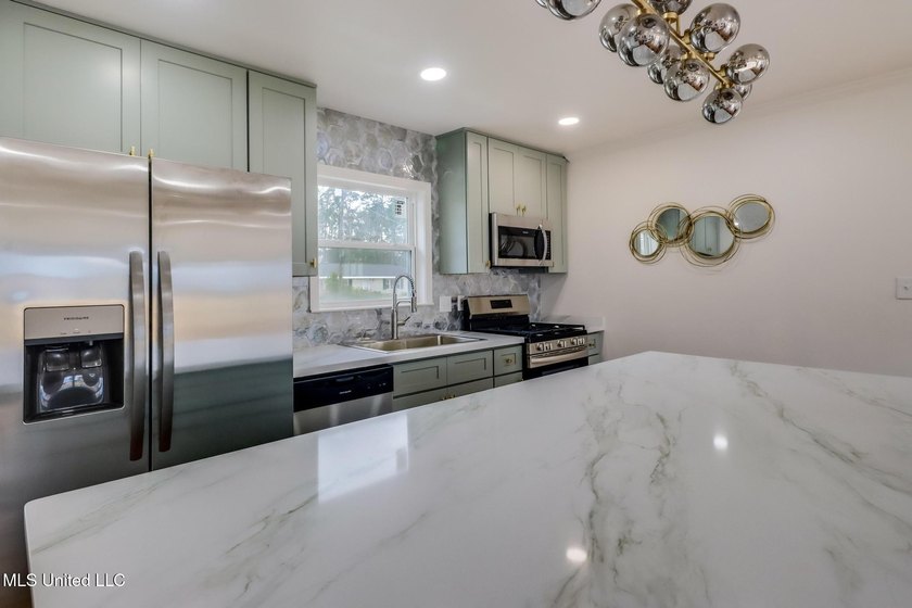Taken down to the studs and completely rebuilt, this home offers - photo 5