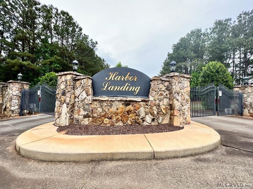Tucked within the gates of Harbor Landing, Lot 67 offers just - photo 7