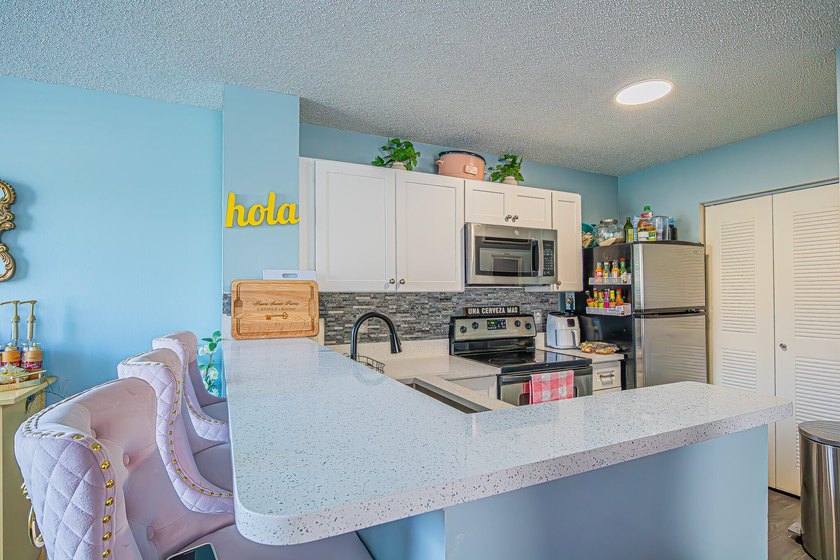 Step into this updated first-floor condo perfectly situated in - photo 6