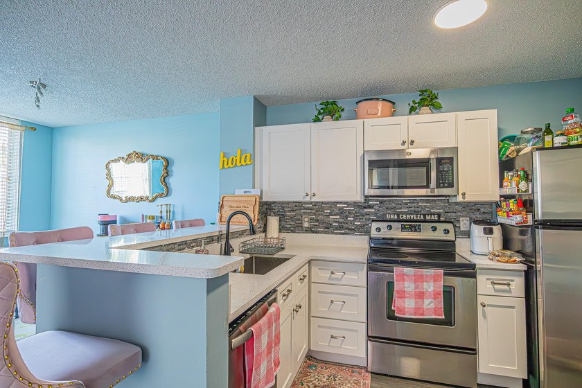 Step into this updated first-floor condo perfectly situated in - photo 7