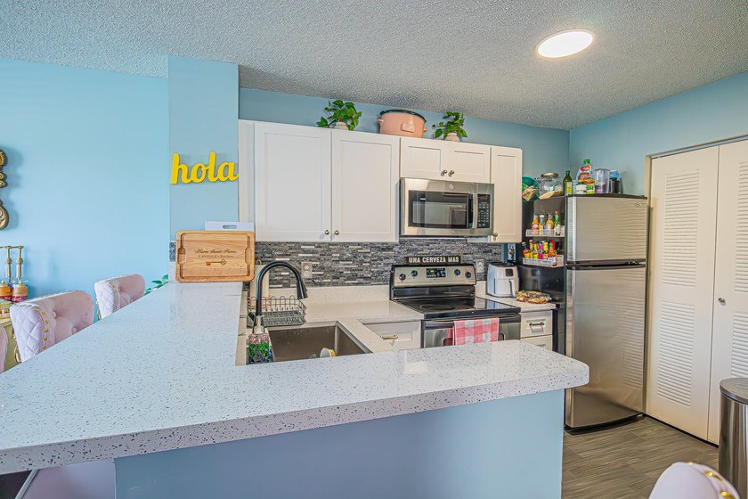 Step into this updated first-floor condo perfectly situated in - photo 8