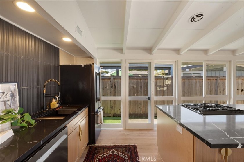 Welcome to this beautifully updated 4-bedroom, 2-bath Cliff May - photo 3