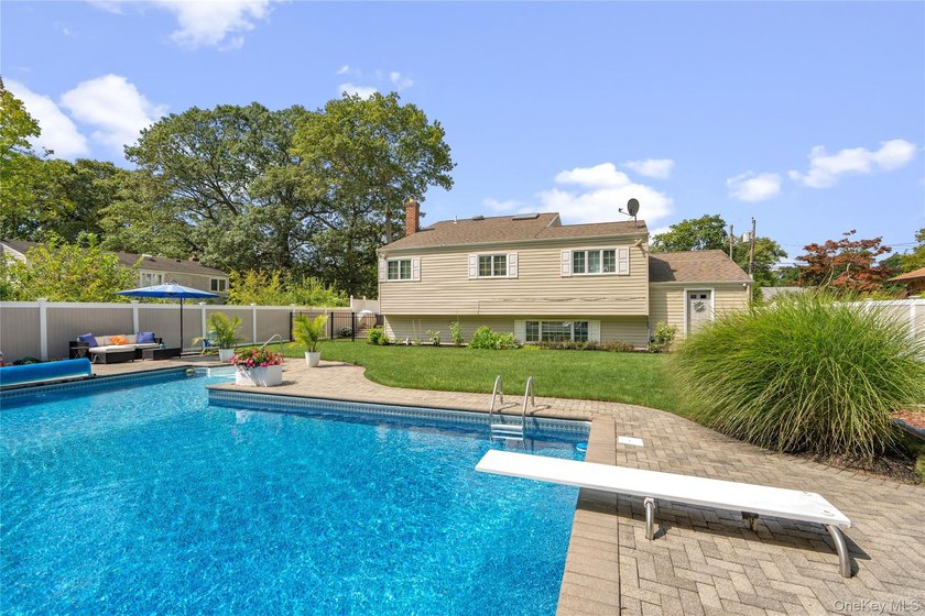 Welcome home to 939 Manor Lane in Bay Shore. This meticulously - photo 36