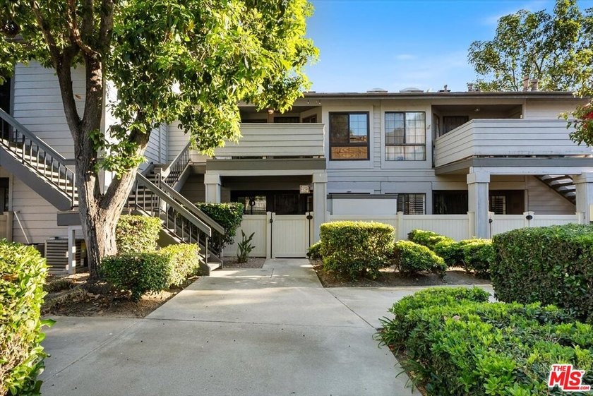Welcome to this spacious two-story townhome-style condo in the - photo 2