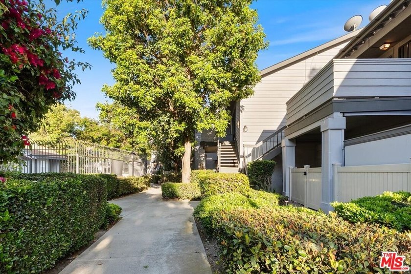 Welcome to this spacious two-story townhome-style condo in the - photo 3